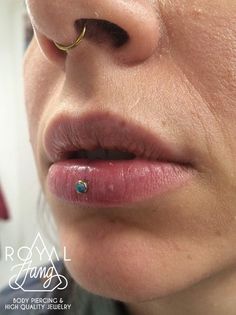 a woman's nose with a piercing on it