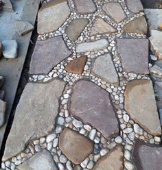 a walkway made out of rocks and stones