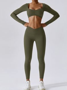 Introducing the Scrunched Top Long Sleeve and V-Waisted Sports Leggings Set ! This stylish design is perfect for any woman who loves to look trendy while working out. The figure-hugging set is made from a nylon-spandex blend, making it stretchy and comfortable. It features a scrunched top long sleeve and high waist leggings with a v-waistband. The ankle-length leggings provide anti-friction and booty lifting capabilities, making them perfect for pilates, yoga, and other training activities. Plus Clothes Material, Long Sleeve Activewear, Train Activities, Yoga Suit, Ankle Length Leggings, Sleeves Style, Workout Games, Leggings Set, Fitness Yoga