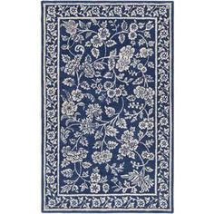 a blue rug with white flowers and leaves on the bottom, in front of a white background