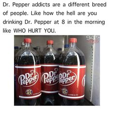 three bottles of dr pepper soda sitting on top of a shelf next to each other