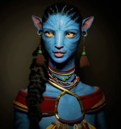 a woman with blue skin and yellow eyes is dressed up as avatar from the movie avatar