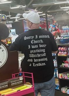 an older man in a black shirt is shopping for items