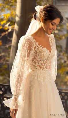 a woman wearing a wedding dress and veil