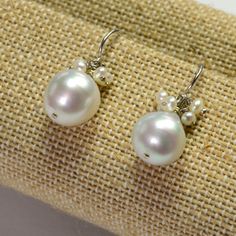 DESCRIPTION: Thank you for coming in! 14K solid white gold earrings with 11mm South Sea white baroque pearls and seed pearl accents! Full of luster and elegance! ! It looks much much nicer on your ears! You will receive the exact pair of earrings in the pictures! WEIGHT: 4.63 Grams LENGTH: 1 inch MATERIAL: 14K Solid White Gold, South Sea White Pearl, Seed Pearls Sky Blue Topaz, White Gold Earrings, South Seas, Seed Pearl, Wow Products, Baroque Pearls, White Pearl, Spring Rings, Rose Cut