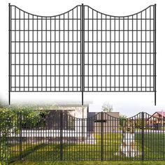 an iron fence with two gates on each side