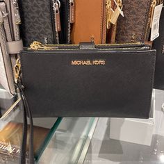 Michael Kors Large Double Zip Wristlet Wallet Phone Case Clutch Black Michael Kors Large Double Zip Wristlet Wallet, Clutch, 100% Genuine Saffiano Leather Gold Tone Hardware 6 Credit Card Holders 1 Id Holder 2 Slip Compartments 2 Zip Pockets A Phone Holder Slot And A Large Bill Section Accessible From The Side 7.25" X 4.25" X 1" Comes With A Detachable Wrist Strap This Is An Outlet Style Michael Kors Wallet With Mobile Phone Bag, Michael Kors Clutch Wallet With Card Slots, Michael Kors Clutch With Zipper Closure, Michael Kors Clutch Wallet With Removable Pouch, Michael Kors Rectangular Clutch For Travel, Michael Kors Clutch With Zipper For Everyday Use, Michael Kors Travel Wallet Clutch, Michael Kors Clutch With Card Slots, Mk Wallet