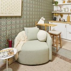 a living room filled with furniture next to a wall covered in books and pictures on the walls