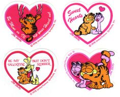 four heart shaped stickers with cartoon characters on them