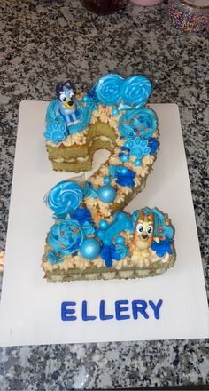 Cake decorating Number 5 Cake Bluey, Number 2 Cupcake Cake Bluey, Bluey Cupcake Pull Apart, Number 2 Bluey Cake, Bluey Cupcake Cake Ideas, Bluey Birthday 2, Bluey Bday Cake, Bluey Cake Ideas 2nd Birthday, Bluey First Birthday Cake