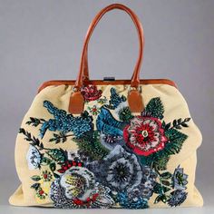 SAN FRANCISCO'S FAVORITE DESIGNER CONSIGNMENT STORES AND ONLINE SHOP VALENTINO Beige Multi Color Woven Leather Beaded Raffia Handbag IN-STORE ID: 131602 VALENTINO handbag in a beige woven raffia featuring a floral embroidered rhinestone design, and brown leather top handles. Very Good Pre-Owned Condition. Some missing rhinestones. Measurements: Length: 18.5 in. Width: 6 in. Height: 13.5 in. Drop: 7.5 in. Original Retail Price (if known): $0.00 Category: Handbag & Leather Goods More Details Brand: VALENTINO Color: Beige Color 2: Multicolour Pattern: Woven Fabric: Beaded Material: Raffia Type of Leather: Leather Style Bag: Overnight Age Group: Adult PAYMENT PayPal or Credit Cards via PayPal, are the only accepted payment methods. Buy Now, Pay Later - a Paypal service is also available at che Raffia Handbag, Brown Leather Top, Valentino Handbags, Woven Raffia, Handbag Leather, Rhinestone Designs, Beaded Material, Consignment Stores, Bead Leather