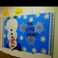 a bulletin board with a snowman on it and the words we love show written in large letters