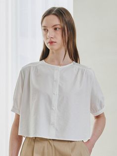 Softly structured, this effortless blouse.It is exceptionally soft and durable.Great outfits start here. - Meet our crisp and light weight blouse- Button up and round neck - It's less likely to wrinkle - Cropped length and rounded hem - Our fabric gives this shirt flexible comfort and it hugs your silhouette- Puff sleeve with buttoned cuffs Summer Crew Neck Blouse With Button Closure, Spring Crew Neck Blouse With Buttons, Everyday Spring Blouse With Button Cuffs, Elegant Crew Neck Top With Button Closure, Crew Neck Cotton Blouse With Button Closure, Summer Crew Neck Blouse For Daywear, Summer Daywear Shirt With Crew Neck, Summer Daywear Blouse With Crew Neck, Summer Crew Neck Shirt For Daywear