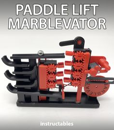 an image of a model made out of legos with text that reads paddle lift marbelvator