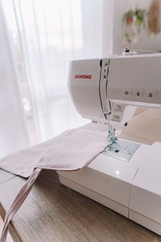 the sewing machine is sitting on top of the table