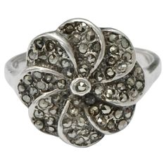 Wonderful Art Deco silver ring set with marcasites, and featuring a lovely flower design. There are no stamps, the ring has tested for silver. Ring size UK P / US 7 1/2, inside diameter 1.9 cm / .74 inch, and the flower is diameter 1.65 cm / .65 inch. Some of the marcasites are part missing. We replaced one marcasite. This is a beautiful vintage silver and marcasite ring. The marcasites really glint in the light. Circa 1930s. Rubellite Ring, Warrior Ring, Art Deco Silver, 10k Gold Ring, Marcasite Ring, Vintage Style Rings, Silver Ring Set, Cameo Ring, Gold Ring Sets