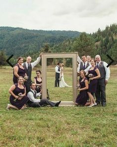 a group of people posing in front of a mirror