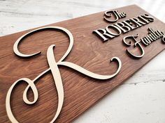 a wooden sign that says the roberts family