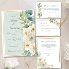 wedding stationery with white flowers and greenery