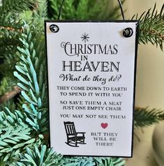 a christmas ornament hanging from a tree with the words, christmas in heaven what do they do?