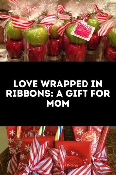 some wrapped apples and candy are in a basket with the words love wrapped in ribbons a gift for mom