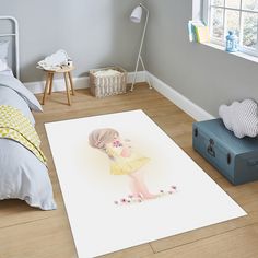 a child's bedroom with a large rug on the floor and a blue suitcase