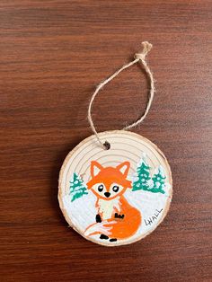 a wooden ornament with an image of a fox on it