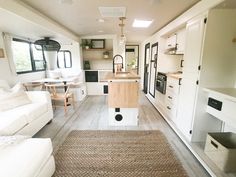 a living room and kitchen area in a mobile home