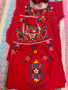 Beautiful Mexican outfits! SHOES NOT INCLUDED SOLD SEPARATELY. Size 1 year old baby girl outfit, includes a hand embroidered blouse, bloomer and headband. Fabric : poplin and cambaya. Care : hand wash/ hang to dry. DRY CLEANING OK. EACH BLOUSE HAS UNIQUE COLORFUL EMBROIDERY. We choose any at random when shipping. Red Floral Embroidered Summer Sets, Summer Embroidered Multicolor Sets, Embroidered Red Summer Sets, Red Cotton Sets For Festival, Summer Sets With Embroidered Border, Festival Embroidered Cotton Sets, Mexican Outfits, Mexican Shoes, Hand Embroidered Blouse