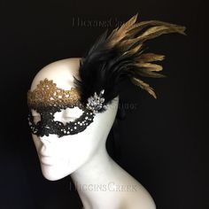 Enchant and captivate with our elegant goddess lace masquerade mask! The ombre effect gracefully transitions from gold to black, adding an air of mystique and sophistication. The sparkling clear rhinestones and brooch accentuate the mask's design while the golden feathers add a touch of opulence and allure, swaying with every movement. This mask is the perfect addition to your look for any masquerade party, ball, or gala!


Age Group/Gender - Adult/Women

Size/Type - One size fits all adults

Ma Lace Masquerade Mask, Masquerade Mask Women, Rhinestone Mask, Lace Masquerade Masks, Clear Mask, Feather Mask, Black Ombre, Masks Masquerade, Masquerade Party