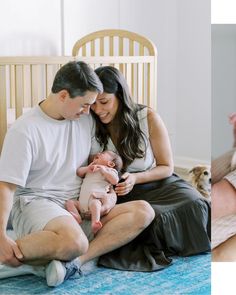 a man and woman sitting on a bed holding a baby