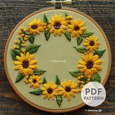 a sunflower embroidery pattern is shown in the hoop