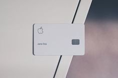 an apple credit card attached to the side of a refrigerator