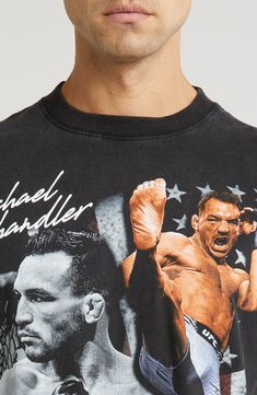 a man wearing a black shirt with an image of a wrestler on it