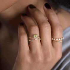 Welcome to TimelessTouchesGoods, where every piece tells a story of elegance and charm. Discover our Peridot Ring in 14k Gold Plated Color, a birthstone promise in 925 Sterling Silver, meticulously crafted to adorn your special moments. ✨ Luxury Redefined: Elevate your style with our Peridot Ring, featuring a square green crystal set in 925 Sterling Silver and bathed in the brilliance of 14k Gold Plating. This piece exudes luxury, making it the perfect wedding band for bridal girls and a strikin Delicate Gold Stackable Rings With Gemstones, Delicate Stackable Yellow Gold Crystal Ring, Delicate Gold Rings With Gemstones, Delicate Gold Gemstone Ring, Delicate 14k Gold Emerald Cut Rings, Delicate Emerald Cut 14k Gold Rings, Delicate Emerald Cut Yellow Gold Jewelry, Fine Jewelry Rose Cut Diamonds Ring For May Birthstone, Gold Solitaire Crystal Ring In Sterling Silver