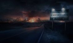 a street sign sitting on the side of a road in front of a city at night