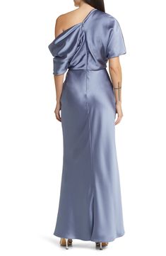 A deliciously draped dress is set off one shoulder and cut from glossy satin that adds to its graceful impression. 61 1/2" length (size 8) Hidden back-zip closure One-shoulder neck Short sleeves Lined 100% polyester Dry clean Imported Black Owned/Founded Off-shoulder Evening Gown With Satin Finish, Formal Off-shoulder Gown With Satin Finish, Formal Draped Gown With Satin Finish, Formal Draped Satin Finish Gown, Elegant Off-shoulder Gown With Satin Finish, Off-shoulder Silk Evening Gown, Silk Off-shoulder Evening Gown, Silk Off-shoulder Evening Dress, Off-shoulder Silk Gown For Evening