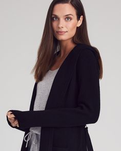 Get ready to cozy up in style.This long, hooded cardigan is made from 100% cashmere, offering the ultimate warmth and comfort. Featuring a classic ribbed knit, deep pockets for keeping your hands toasty or your belongings close, and a belt tie to keep you snug, it’s perfect for layering on cooler days. Whether you pair it with jeans, leggings, or your go-to cashmere joggers, this versatile cardigan will be your favorite companion for laid-back luxury. 100% CashmereRibbed KnitHood & Belt TieDeep Cozy Hooded Cashmere Outerwear, Everyday Cashmere Outerwear With Ribbed Cuffs, Cozy Cashmere Sweater Coat For Loungewear, Cozy Cashmere Sweater Coat For Everyday, Cozy Everyday Cashmere Sweater Coat, Cashmere Joggers, Cashmere Wrap Sweater, Versatile Cardigan, Hooded Cardigan Sweater