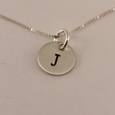 Petite Sterling Silver Personalized Initial Charm Necklace - Hand stamped Everyday Sterling Silver Charm Necklace With Box Chain, Small Personalized Sterling Silver Necklace, Simple Sterling Silver Charm Necklace For Personalized Gifts, Silver Hand Stamped Meaningful Charm Necklace, Meaningful Hand Stamped Sterling Silver Charm Necklaces, Meaningful Hand Stamped Sterling Silver Charm Necklace, Classic Sterling Silver Hand Stamped Necklaces, Sterling Silver Hand Stamped Pendant Charm Necklace, Minimalist Stamped Sterling Silver Charm Necklaces