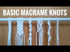 some white yarn is hanging on a wooden wall with the words basic macrame knots