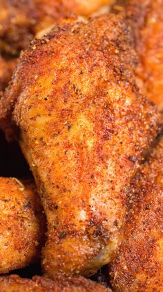 closeup of chicken wings with seasoning on them