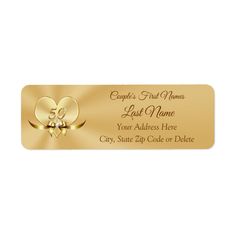 a gold foiled label with two hearts and an embellishment on the bottom