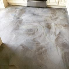 a kitchen floor that is covered in dirt