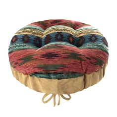 a multicolored round ottoman cushion with ties on the front and back ends, sitting on a white background