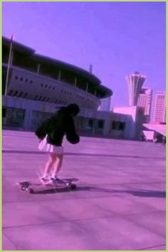 a person on a skateboard in front of a building