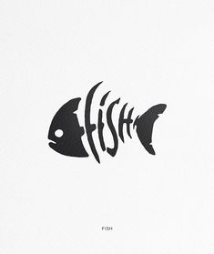 a fish that is on the side of a white wall with black lettering in it