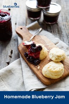 biscuits with jam and jelly on a wooden cutting board