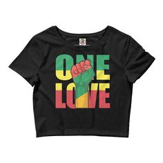 Introducing the One Love Rasta Crop Top - the perfect addition to your summer wardrobe! This stunning crop top is designed with a vibrant Rasta color scheme, featuring bold green, yellow, and red stripes that are sure to turn heads. Made from a soft and comfortable cotton blend, this crop top is perfect for keeping you cool and comfortable on those hot summer days. The relaxed fit and sleeveless design make it easy to wear and style, while the cropped length adds a trendy touch to any outfit. Th Green Cropped Top For Streetwear, Green Cropped Cotton Shirt, Green Cotton Cropped Shirt, Green Graphic Print Crop Top For Streetwear, Casual Green Crop Top With Graphic Print, Green Cropped Crop Top For Streetwear, Trendy Green Cropped T-shirt For Summer, Green Letter Print Crop Top For Streetwear, Green Letter Print Crop Top