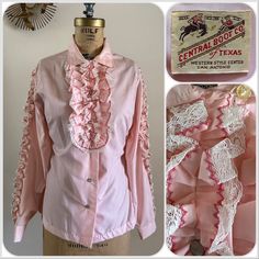 "For your consideration Vintage 1960s women's ruffle & lace bib tuxedo western shirt by \"Central Boot Co. of Texas\". Has ruffles down each sleeve. No pockets. Unlined. \"Convert-A-Blouse\" \"wear in or out\" shirt with side vents. Feels like cotton poly blend. Marked size 36 bust. Fits like a modern S/M, - see measurements below. Pre owned, shows light general wear. Overall great fun blouse, minor flaws. Good for costume, rodeo or stage. Sold as is. Faint marks and age yellowing in areas (main Fitted Long Sleeve Tops With Scalloped Edges, Feminine Fitted Shirt With Ruffled Collar, Fitted Shirt With Ruffled Collar In Feminine Style, Pink Lace Blouse With Ruffles, Fitted Pink Blouse With Lace Collar, Vintage Tops With Lace Cuffs And Ruffled Collar, Vintage Spring Tops With Lace Trim, Vintage Fashion Lace Trim Tops For Spring, Vintage Lace Trim Tops For Spring