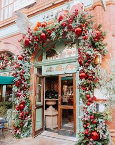 an entrance to a building decorated for christmas